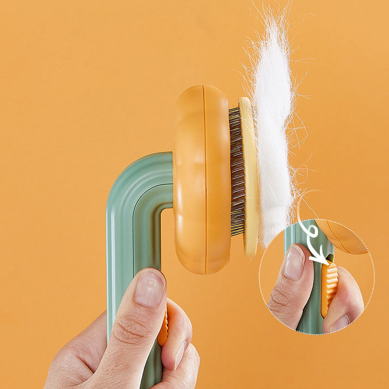 Pet brush with a hair removal and massage system.